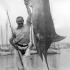 Ernest Hemingway posing with a marlin, Cuba, 1934